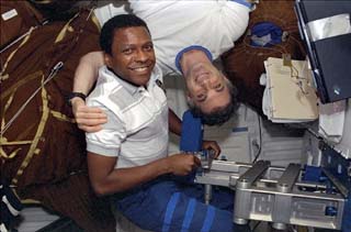 STS-89 Mission Specialists Michael Anderson and David Wolf converse on the middeck of the Orbiter Endeavour.